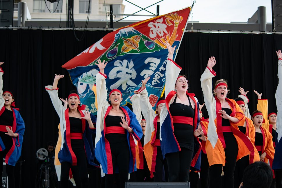 Sakuramai performing with flag at Japan Festival Canada
