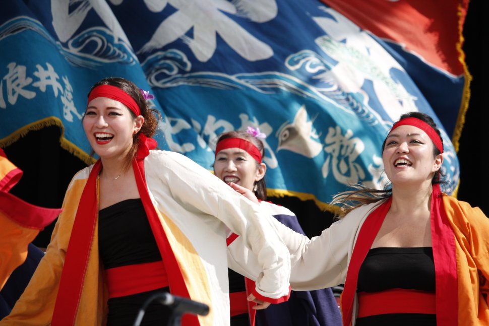 Sakuramai performing with flag at Japan Festival Canada